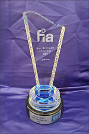 Crystal Wave Shaped Award on a round black wood base